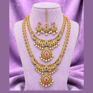 Gold-Plated Peacock Combo Necklace Set - Short Necklace + Long Haram with Ruby Emerald CZ & Pearl Drops - With Matching Earrings & Maang Tikka