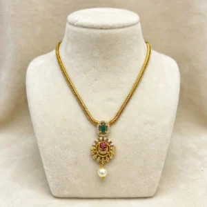 Gold-Plated Braided Chain with Oval Green Stone Pendant, Ruby Pink Floral Work & Pearl Drop